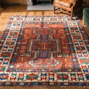 Small Antique Late 19th Century Caucasian Kazak Key Hole Design Coral Rug (SKU 19745) - styled overhead view