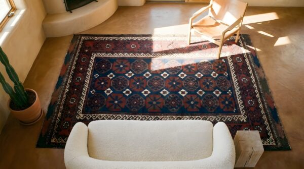 Small scatter size blue background antique tribal geometric persian baluch rug (sku 25435) - styled overhead view