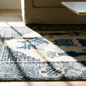 Small Scatter Size Antique Ivory Chinese Geometric Medallion Baotou Rug (SKU 23238) - in-room detail