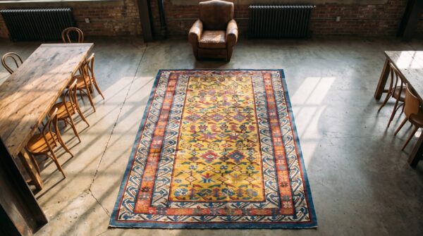 Small tribal geometric antique yellow caucasian seychour wool pile rug (sku 17900) - styled overhead view