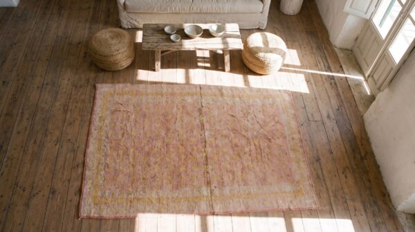 Antique soft coral color small size wool pile indian agra rug (sku 20365) - styled overhead view