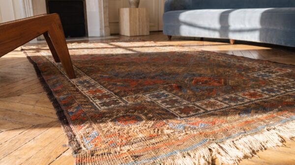 Soft earthy color antique tribal islamic prayer design baluch persian rug 6 Soft earthy color antique tribal islamic prayer design baluch persian rug (sku 21300) - in-room detail