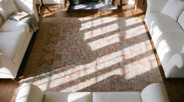 Soft light coral antique tribal medallion design cotton agra rug 2 Soft light coral antique tribal medallion design cotton agra rug (sku 21743) - styled overhead view