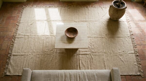 Antique solid abstract flat woven ivory cream color persian room size kilim rug 2 Antique solid abstract flat woven ivory cream color persian room size kilim rug (sku 19556) - styled overhead view