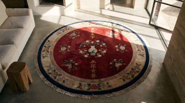 Antique solid red open field round chinese art deco rug (sku 22093) - styled overhead view