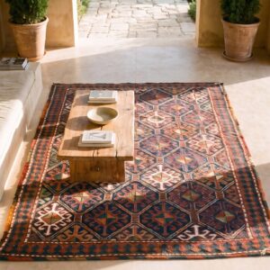 Antique Soumak Persian Geometric Rug (SKU 25089) - styled overhead view