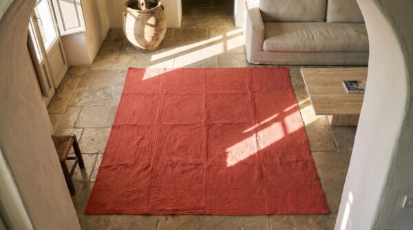 Square 1920s coral jewel tones allover floral needlework wool antique rug 2 Square 1920s coral jewel tones allover floral needlework wool antique rug (sku 20717) - styled overhead view