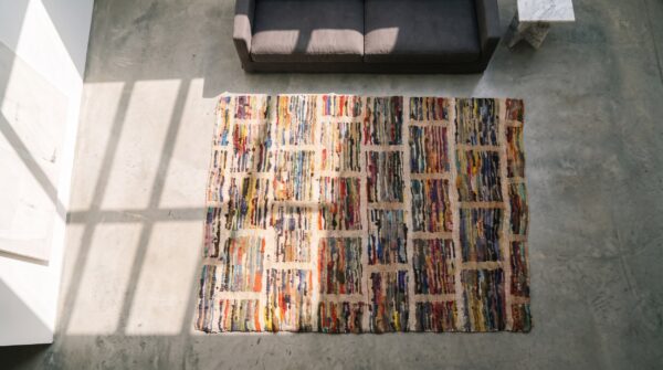 Antique square geometric layered brick pattern american hooked rug (sku 20485) - styled overhead view