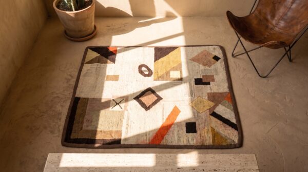 Square hooked ivory american antique wool small scatter size 1930s rug 2 Square hooked ivory american antique wool small scatter size 1930s rug (sku 20519) - styled overhead view
