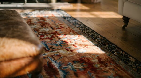 Antique textile small scatter size wool coral rug (sku 23944) - in-room detail