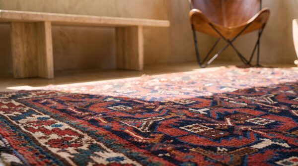 Tribal antique bold persian afshar square small coral rug 7 Tribal antique bold persian afshar square small coral rug (sku 22453) - in-room detail