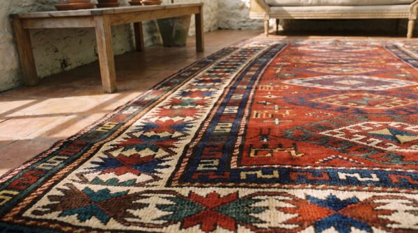Antique tribal geometric coral caucasian kazak rug (sku 18390) - in-room detail