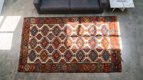 Tribal geometric antique nw persian ivory kurdish hallway runner rug 2 Tribal geometric antique nw persian ivory kurdish hallway runner rug (sku 21372) - styled overhead view