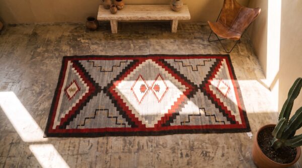 Tribal geometric pattern antique gray flat weave native american navajo rug 2 Tribal geometric pattern antique gray flat weave native american navajo rug (sku 21315) - styled overhead view