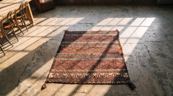 Antique tribal geometric persian baluch square small scatter rug (sku 21588) - styled overhead view