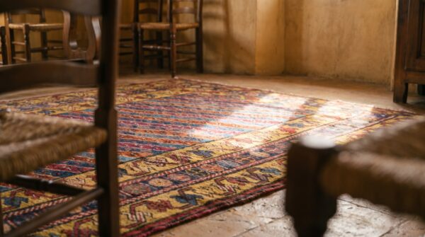 Tribal geometric striped antique caucasian karabagh knotted rug 8 Tribal geometric striped antique caucasian karabagh knotted rug (sku 18058) - in-room detail