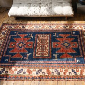 Antique Tribal Primitive Design Hand Knotted Wool Pile Blue Caucasian Rug (SKU 19576) - styled overhead view