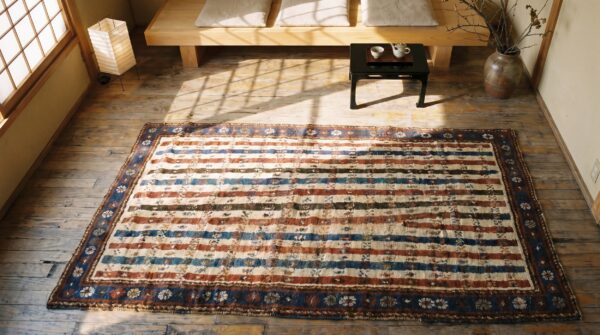 Tribal stripped antique ivory caucasian late 19th century rug (sku 19119) - styled overhead view