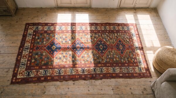 Unusual unique antique artistic tribal geometric caucasian shirvan rug 2 Unusual unique antique artistic tribal geometric caucasian shirvan rug (sku 20138) - styled overhead view