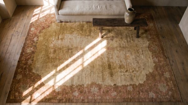 Warm light washed out cream color minimalist open field antique chinese deco rug (sku 21868) - styled overhead view