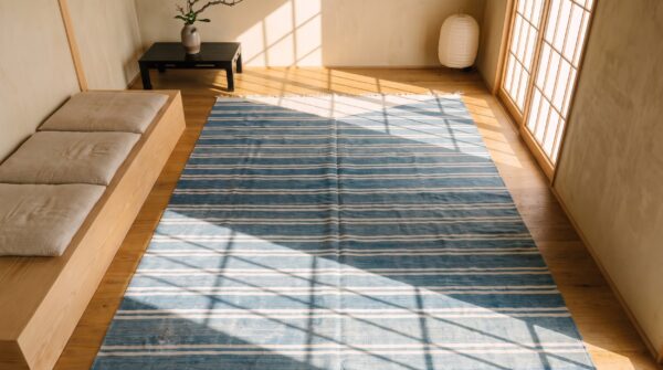 White and blue striped antique long oversized indian dhurrie flatweave rug 2 White and blue striped antique long oversized indian dhurrie flatweave rug (sku 21046) - styled overhead view