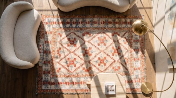 White and rustic red antique indian diamond pattern cotton agra rug 2 White and rustic red antique indian diamond pattern cotton agra rug (sku 19974) - styled overhead view