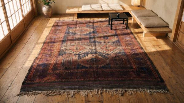 Worn distressed antique shabby chic persian baluch geometric tribal rug (sku 21565) - styled overhead view