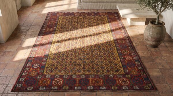 Yellow antique tribal geometric caucasian shirvan area rug (sku 18538) - styled overhead view