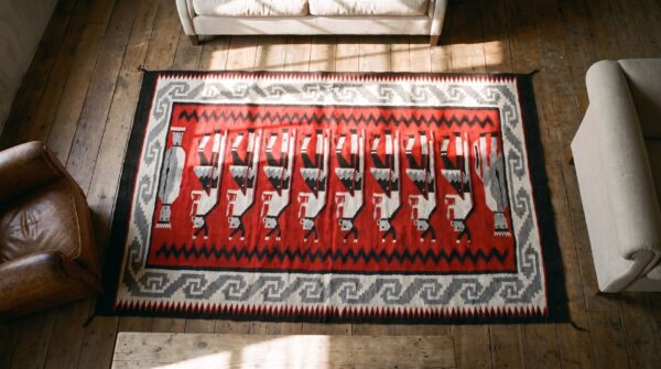 Antique zapotec small scatter size wool red rug (sku 21456) - styled overhead view
