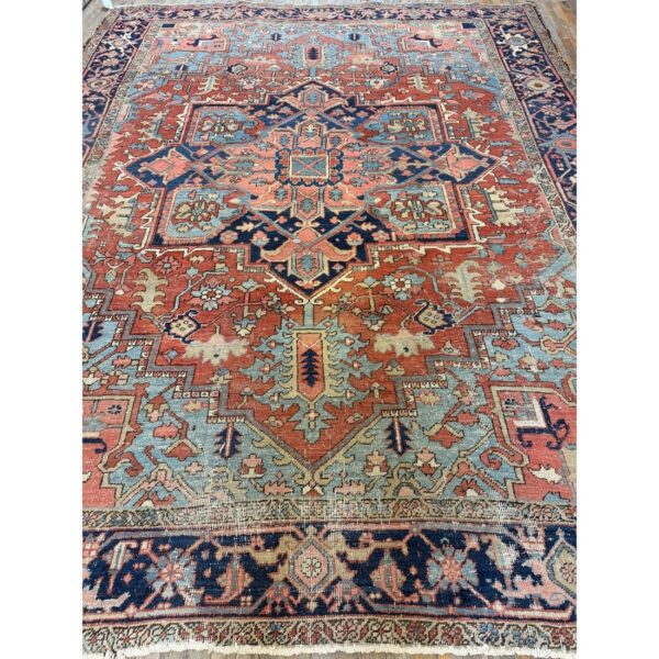 1890s red field medallion rustic antique heriz knotted wool rug - detail view 2