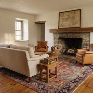 1890s Antique Heriz Rug 9'5 x 12'5 in a Hudson Valley stone farmhouse living room, styled visualization