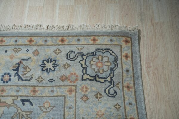 Captivating timeless light blue hand knotted wool rug 10 x 14, detail view 2