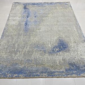 Steel blue and gray abstract hand knotted wool rug 8 x 10, angled floor view