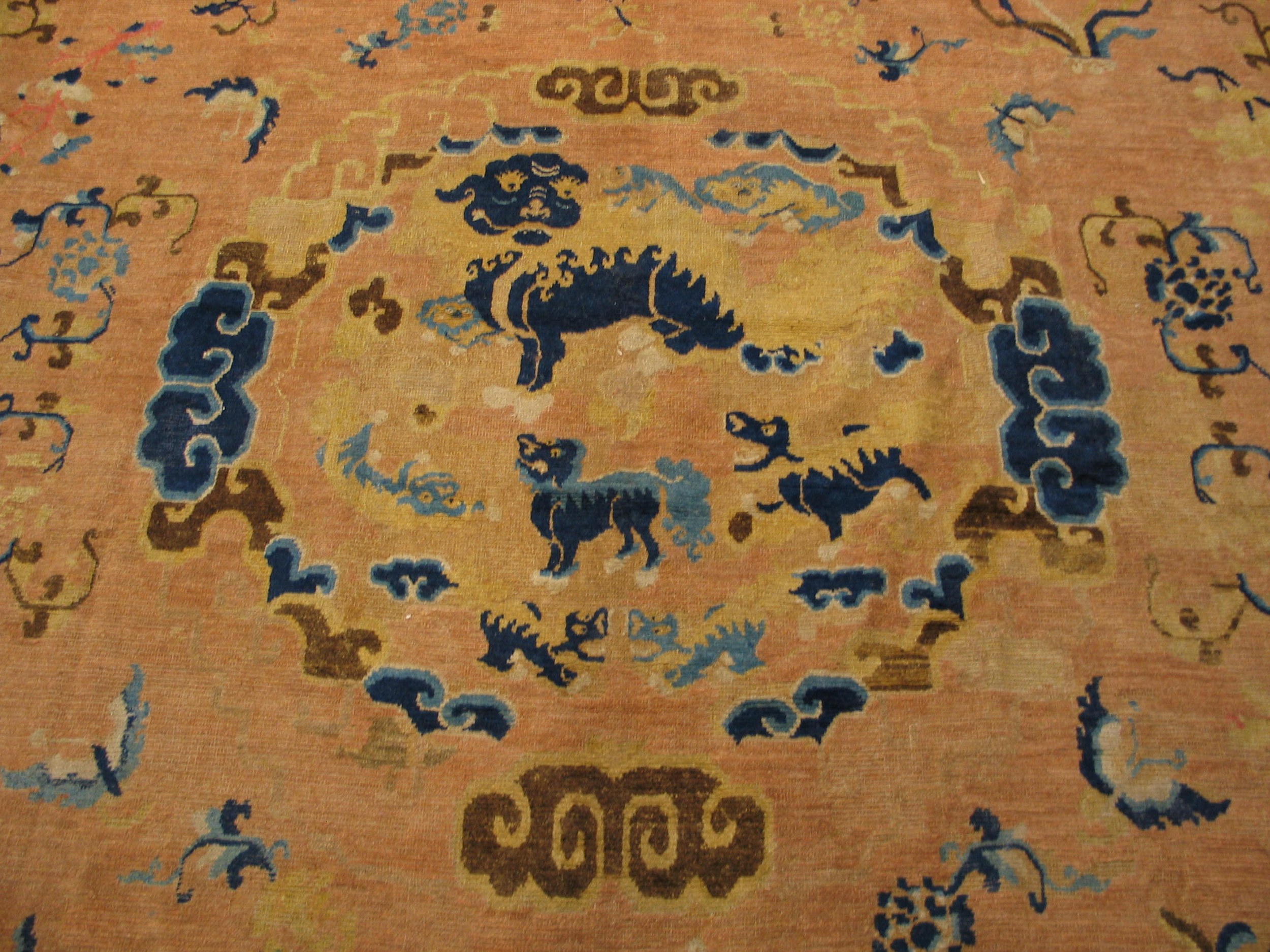 Antique ningxia carpets: a collector's guide to early chinese carpets 3 Central roundel with mythical beasts and clouds on a mid-18th century chinese ningxia carpet