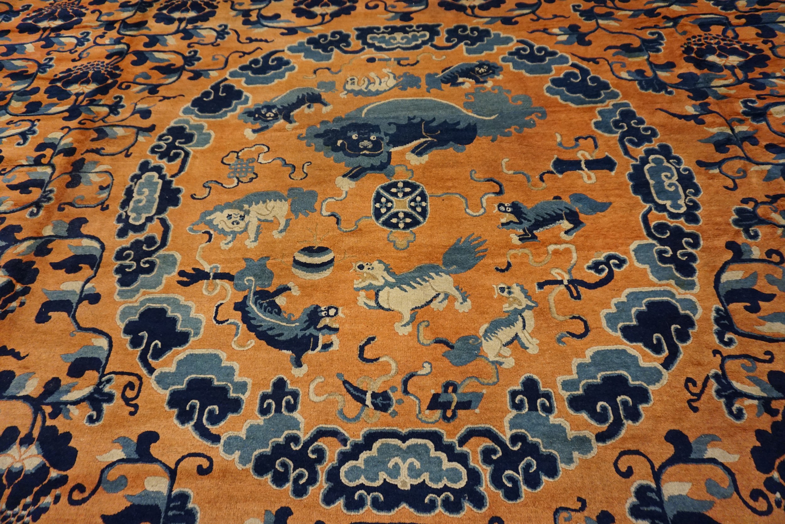 Antique ningxia carpets: a collector's guide to early chinese carpets 4 Central roundel and blue lotus scrolls on the apricot field of a mid-19th century chinese ningxia carpet