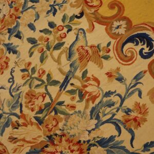 Early 18th century French tapestry weave rug, a parrot among flowers in the field, stock number 25095