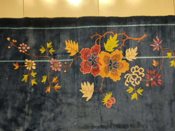 Navy blue color field antique floral pattern chinese deco rug by walter nichols 18 Navy blue color field antique floral pattern chinese deco rug by walter nichols, detail photo 11, stock number 25227