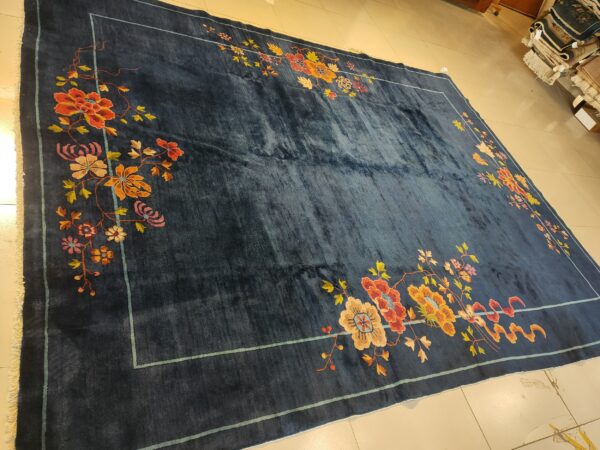 Navy blue color field antique floral pattern chinese deco rug by walter nichols 22 Navy blue color field antique floral pattern chinese deco rug by walter nichols, detail photo 15, stock number 25227