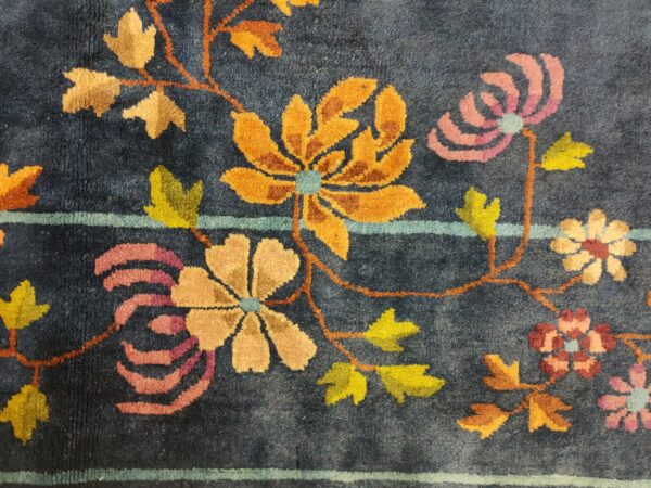 Navy blue color field antique floral pattern chinese deco rug by walter nichols 23 Navy blue color field antique floral pattern chinese deco rug by walter nichols, detail photo 16, stock number 25227