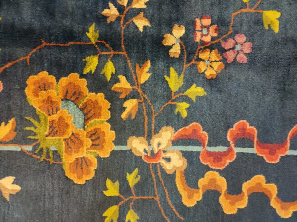 Navy blue color field antique floral pattern chinese deco rug by walter nichols 26 Navy blue color field antique floral pattern chinese deco rug by walter nichols, detail photo 19, stock number 25227