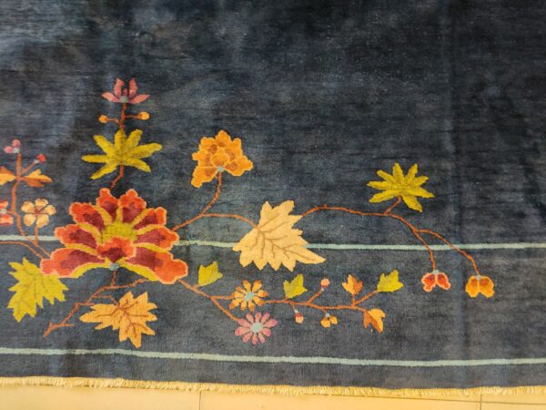Navy blue color field antique floral pattern chinese deco rug by walter nichols 28 Navy blue color field antique floral pattern chinese deco rug by walter nichols, detail photo 21, stock number 25227
