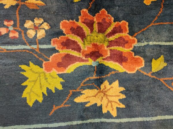 Navy blue color field antique floral pattern chinese deco rug by walter nichols 13 Navy blue color field antique floral pattern chinese deco rug by walter nichols, detail photo 6, stock number 25227