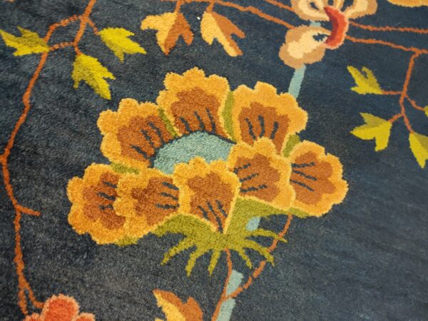 Navy blue color field antique floral pattern chinese deco rug by walter nichols 14 Navy blue color field antique floral pattern chinese deco rug by walter nichols, detail photo 7, stock number 25227
