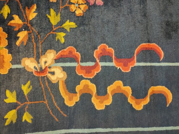 Navy blue color field antique floral pattern chinese deco rug by walter nichols 16 Navy blue color field antique floral pattern chinese deco rug by walter nichols, detail photo 9, stock number 25227