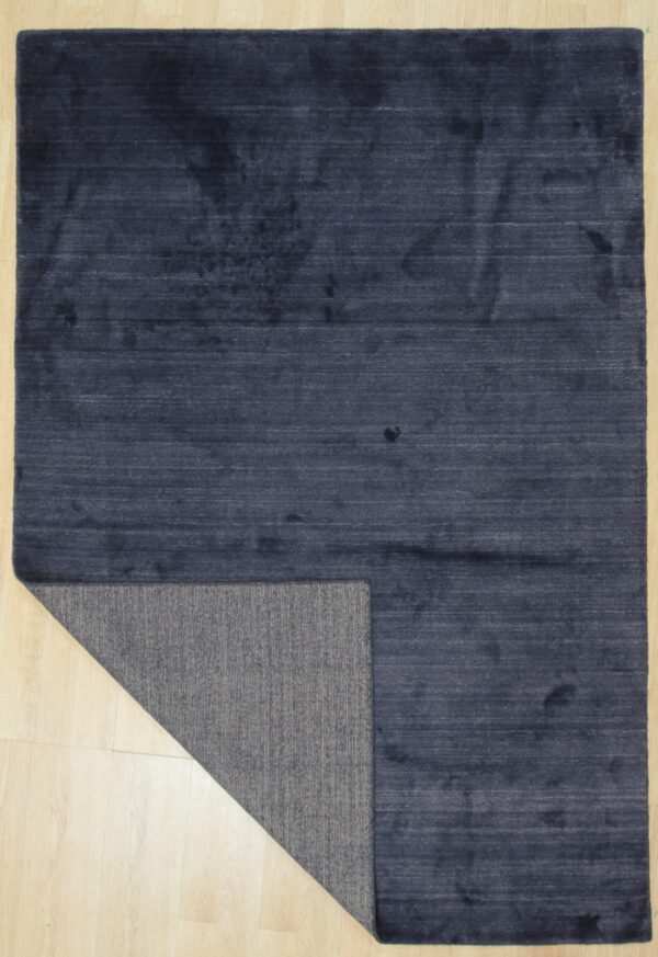 Loom urban navy handmade wool & viscose rug - 8 x 10 size rugs 7 Navy blue solid rug with one corner folded to show the woven back (sku ocu90nv8x10)